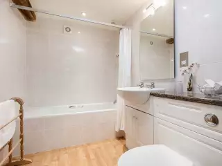 Bath with overhead shower